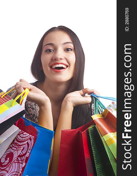 Portrait of young cute brunette with colorful paper bags. Portrait of young cute brunette with colorful paper bags