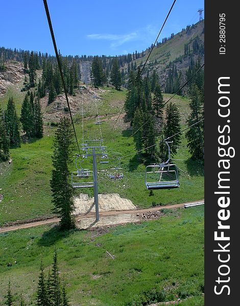 Taking a ride in the summer at a ski resort on a chairlift. Taking a ride in the summer at a ski resort on a chairlift