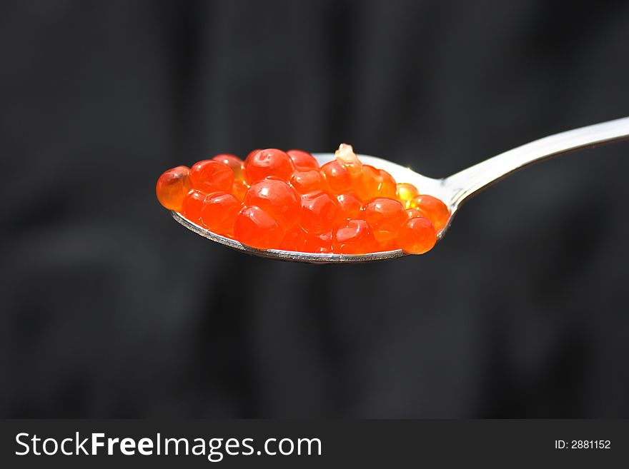 Red caviar in the spoon