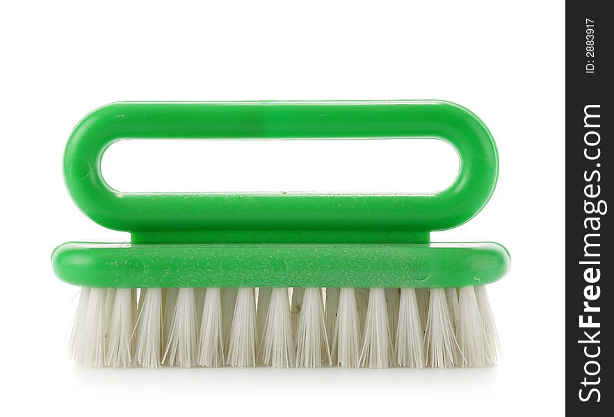 Green clothes-brush isolated over a white background