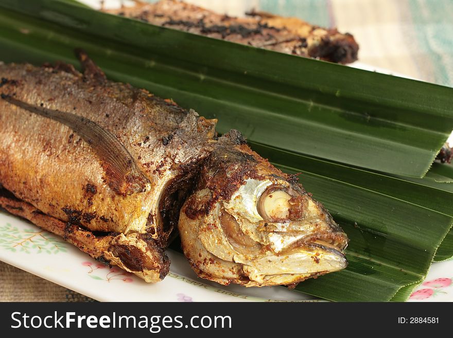 Malaysian pan fried whole mackerel with chili stuffing. Malaysian pan fried whole mackerel with chili stuffing