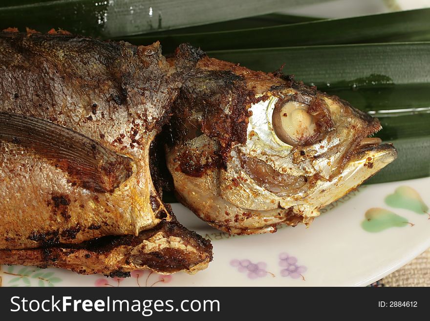 Malaysian pan fried whole mackerel with chili stuffing. Malaysian pan fried whole mackerel with chili stuffing