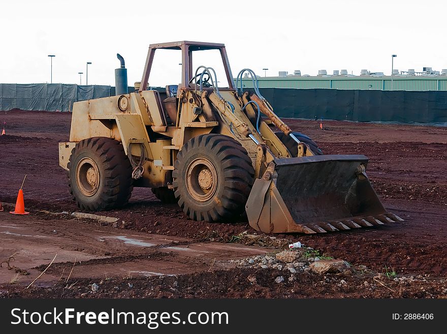 Construction loader at a job site ready to work