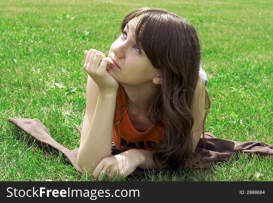 Girl lying on a green grass. Girl lying on a green grass