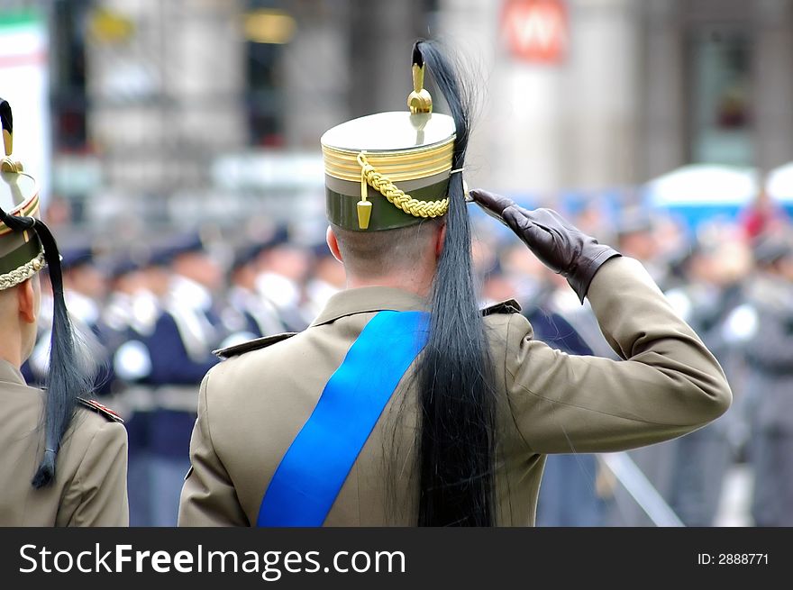 Italian soldier in traditional militar clothes during a fareway to an officier