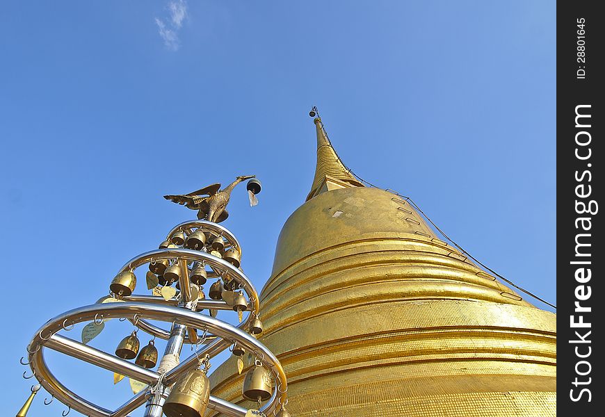 Golden pagoda and swan's pillar in low angle view. Golden pagoda and swan's pillar in low angle view