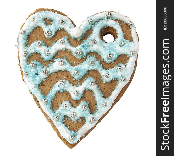 Handmade gingerbread cookie in the form of heart on white background