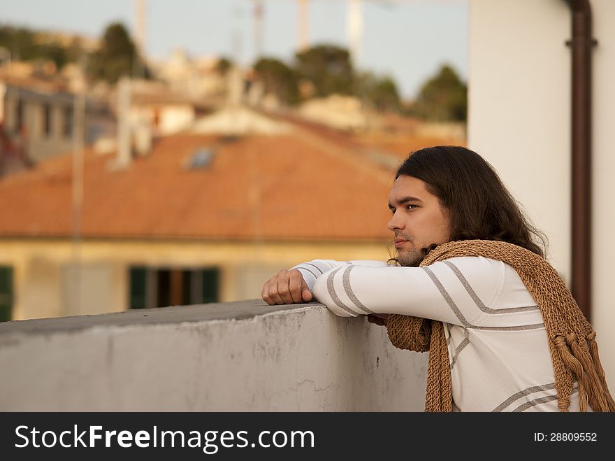 Portrait of young handsome sexy guy looking at the roof Italy. Portrait of young handsome sexy guy looking at the roof Italy