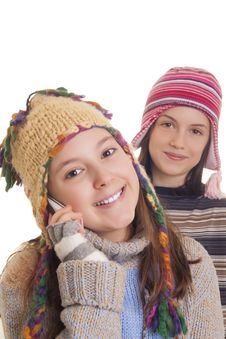 Beautiful Young Girl In Warm Winter Clothes Speaking On A Mobile Royalty Free Stock Photography