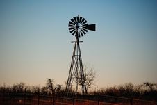 Bared Wire Fence And Water Windmill Royalty Free Stock Photography Bared Wire Fence And Water Windmill Royalty Free Stock Photography