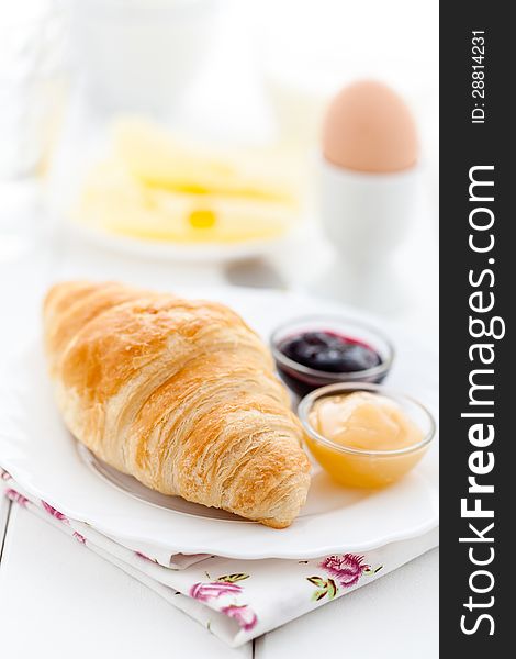 French breakfast with croissant, cheese, egg and jam. French breakfast with croissant, cheese, egg and jam