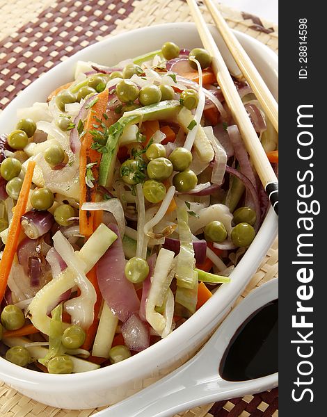 Veggie salad, oriental style, with chopsticks. Veggie salad, oriental style, with chopsticks