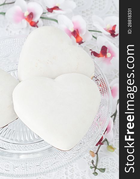 Cookies with icing in the form of heart on a glass base, selecti