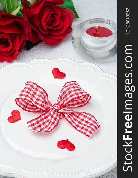 Festive table setting Valentine&#x27;s Day, hearts, ribbon, roses and