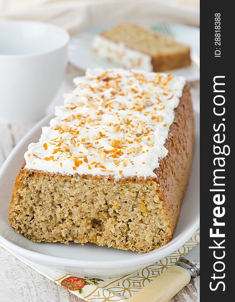 Orange cake with cream cheese frosting, closeup