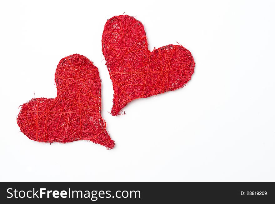 Two red hearts  on a white background