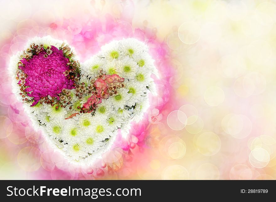 Heart of flowers with a blurred background as a Valentine's card. Heart of flowers with a blurred background as a Valentine's card