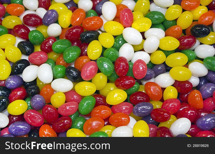 Multi colored candy in the form of peas