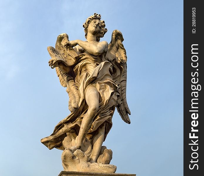 Statue of an angel standing on the bridge leading to the Castle Sant'Angelo, Rome. Statue of an angel standing on the bridge leading to the Castle Sant'Angelo, Rome