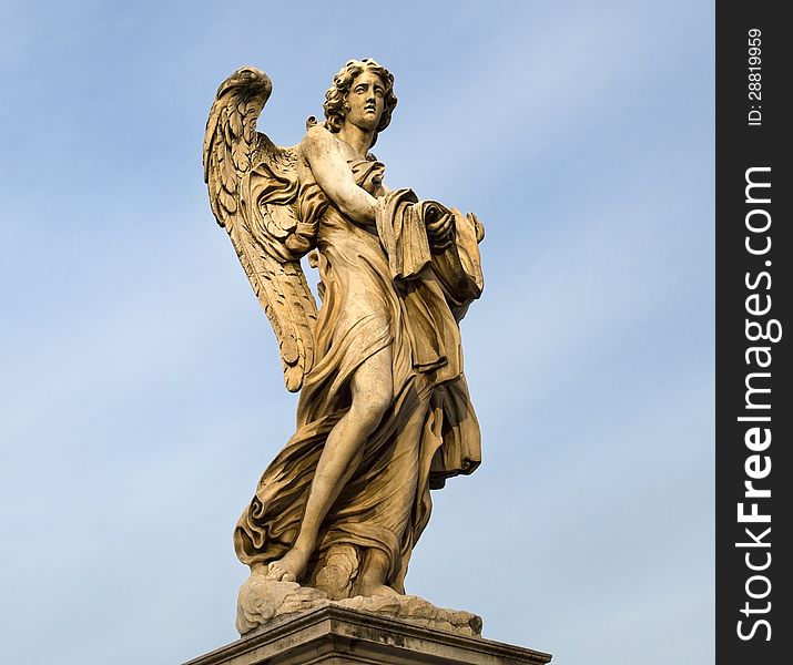 Statue of an angel standing on the bridge leading to the Castle Sant'Angelo, Rome. Statue of an angel standing on the bridge leading to the Castle Sant'Angelo, Rome