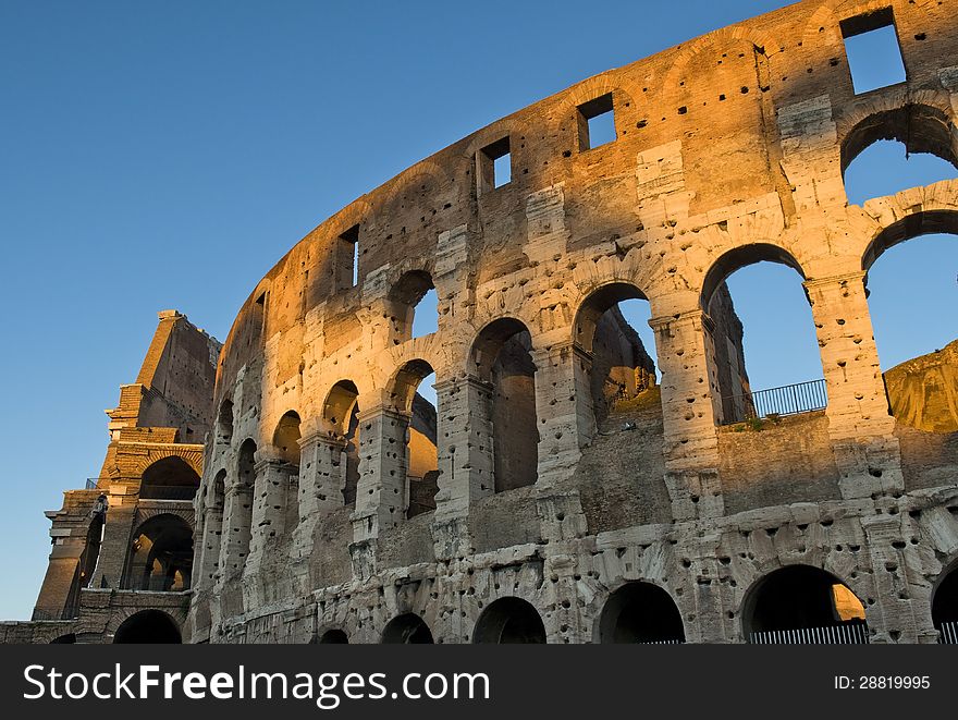 Magnificent Colosseum in the first rays of sun, Rome, Italy