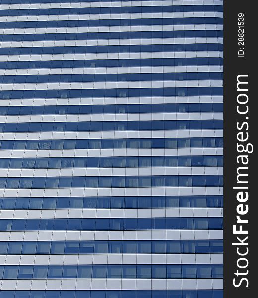 Glass surface on office building in sunshine. Glass surface on office building in sunshine