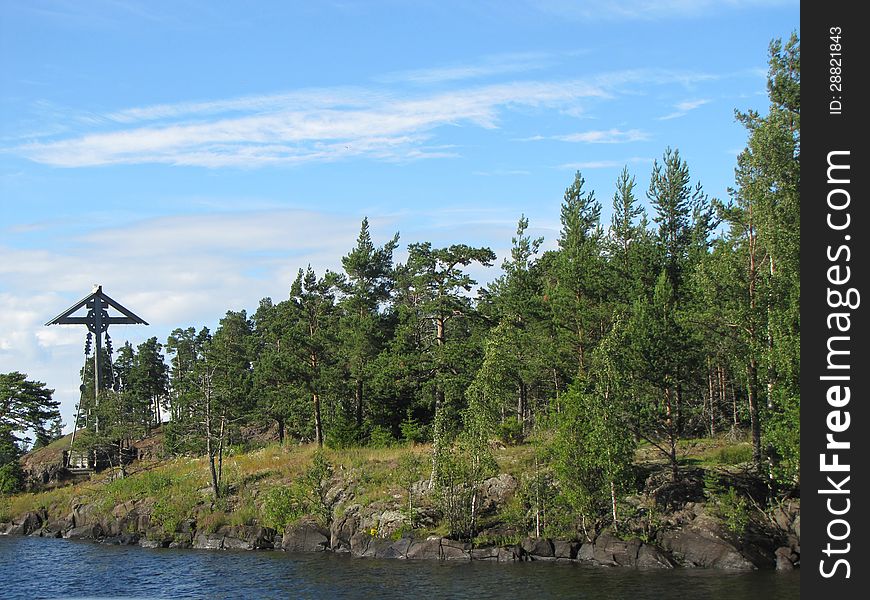 Strange landscape with large wooden cross