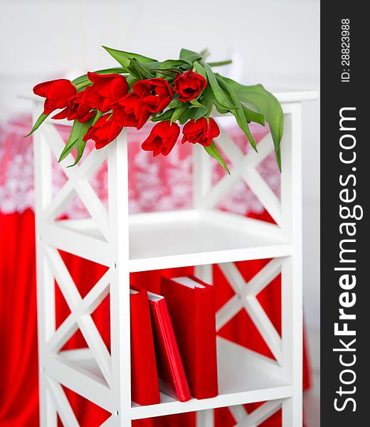 Red Flowers On A White Stand