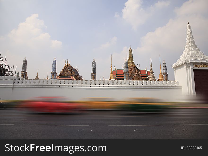 Blurred car on the street in front of Wat Phra Kaew Temple in bangkok thailand