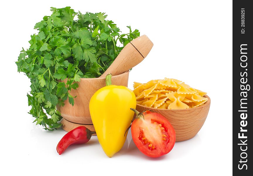 Wooden mortar with parsley, vegetable and pasta, food ingredient photo. Wooden mortar with parsley, vegetable and pasta, food ingredient photo