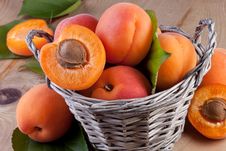 Apricots In Basket On Wood Background Stock Image