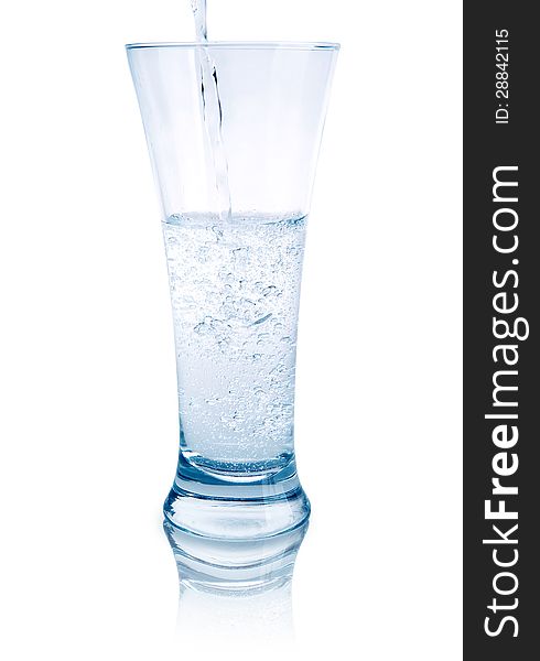 Сlear water pouring into glass. Сlear water pouring into glass