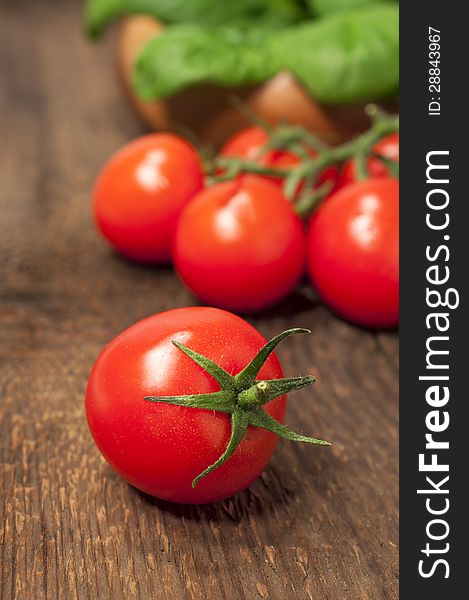 Cherry tomatoes on a wooden background