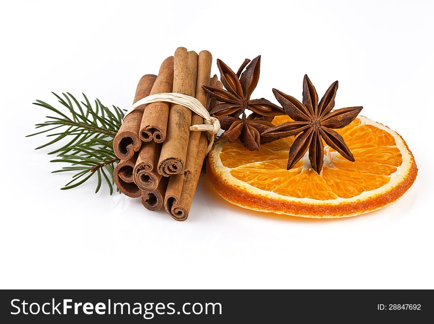 Orange slices, cinnamon with fir branch on white. Orange slices, cinnamon with fir branch on white