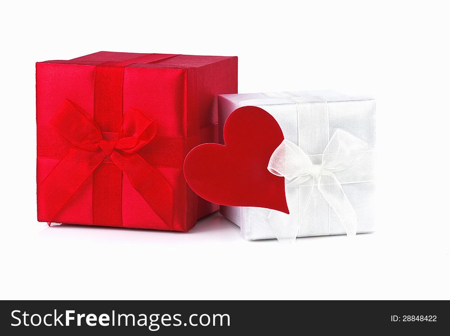 Gift box with red heart isolated on white background