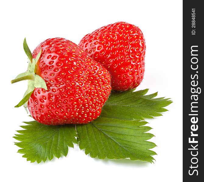 Fresh strawberry with leaf isolated on white