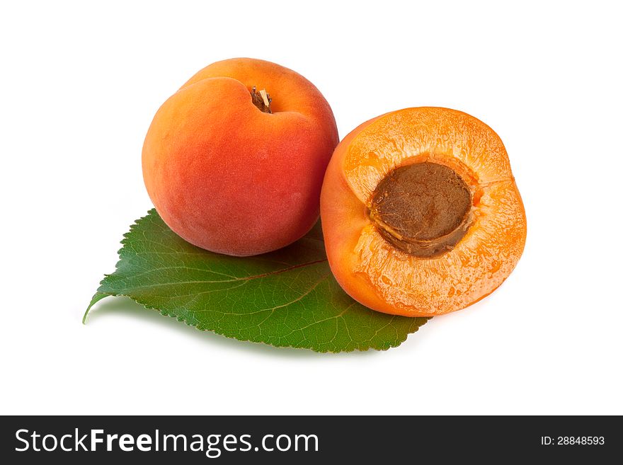 Apricots with leaf isolated on white backgound