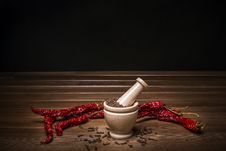 Marble Mortar With Spices Black Pepper, Carnation And Red Hot Pepper Royalty Free Stock Photography