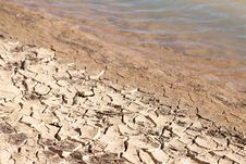 Contrast Concept Of Dry Cracked Mud Next To Water Royalty Free Stock Photos Contrast Concept Of Dry Cracked Mud Next To Water Royalty Free Stock Photos