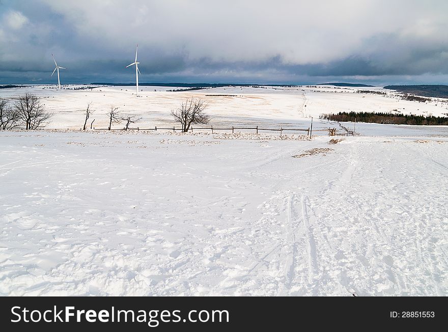 Winter landscape with two wind power