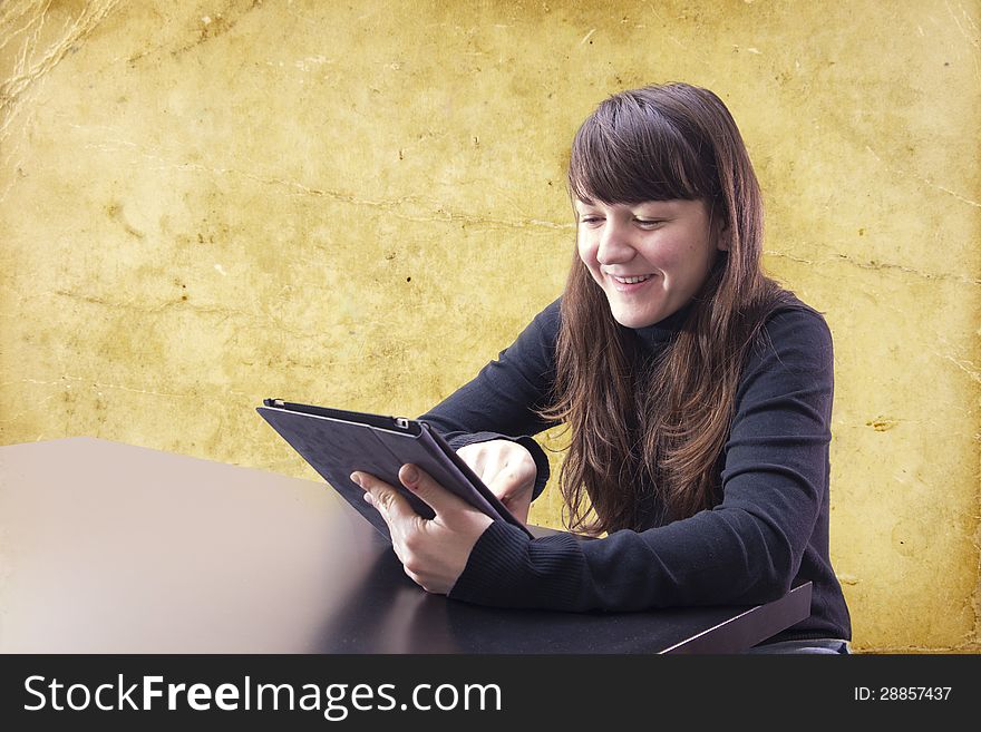 Young woman working with tablet computer. Young woman working with tablet computer