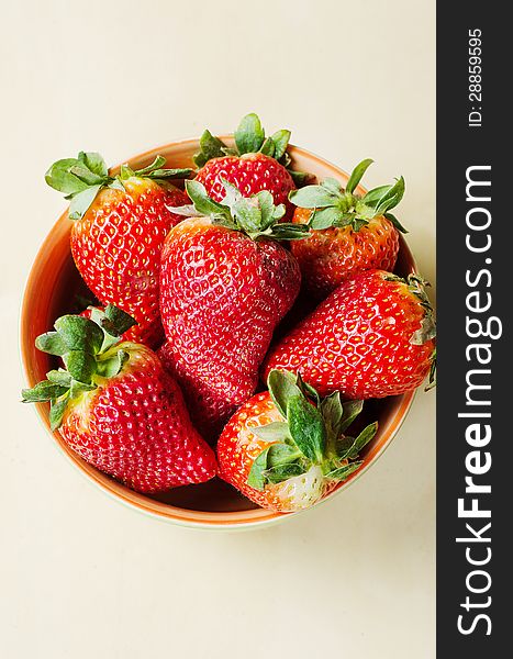 Fresh big strawberries in a bowl