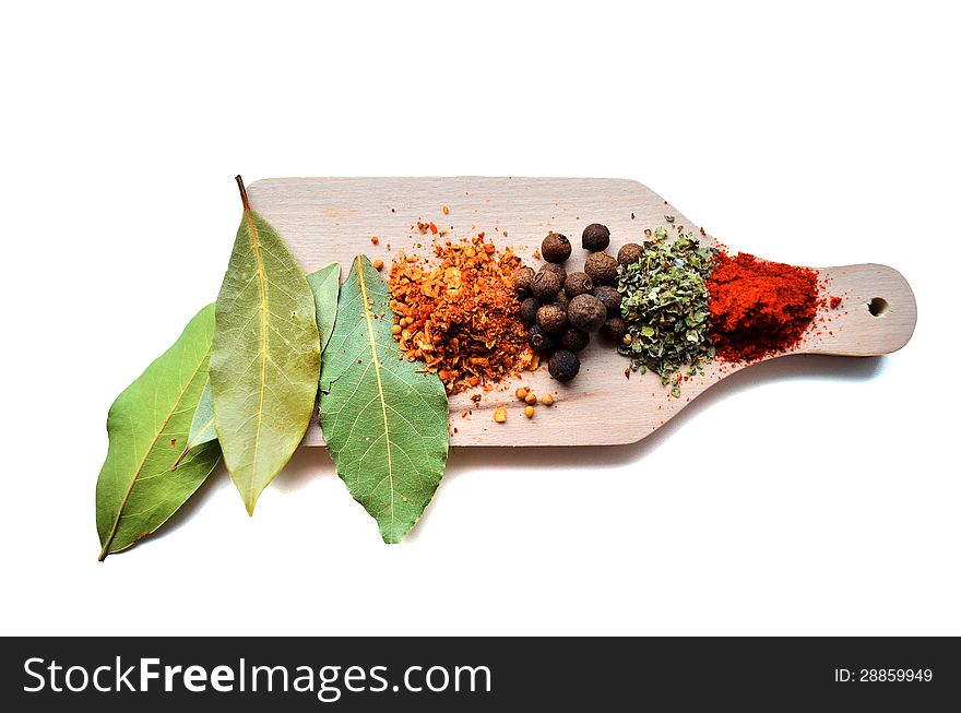 Colourful spices on wooden desk