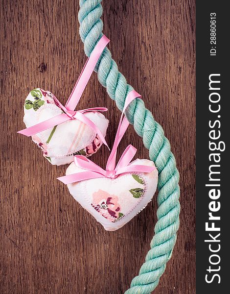 Valentine Hearts Hanging On Rope On Wooden Background