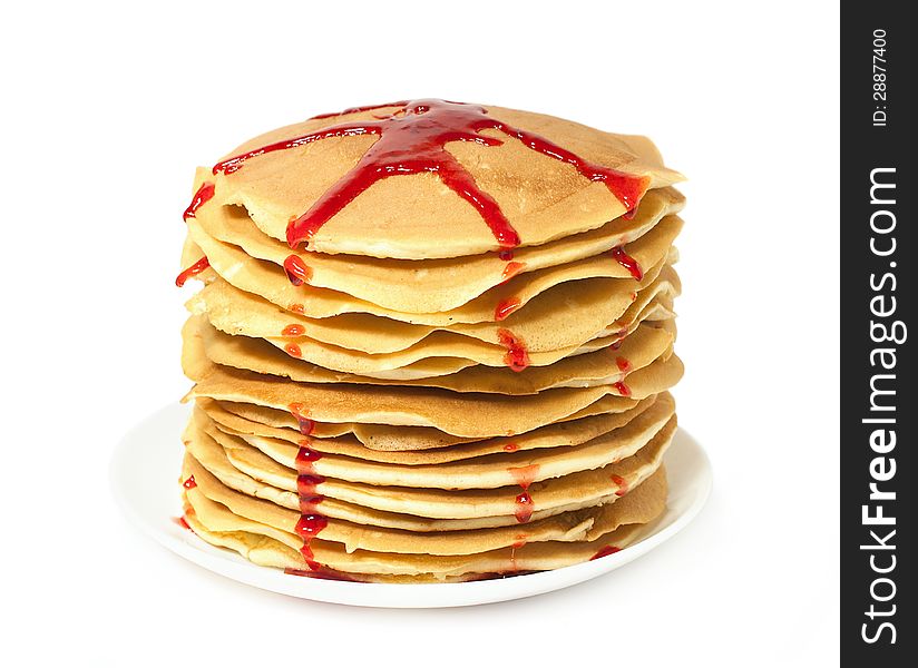 Stack of pancakes with jam over white