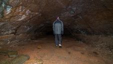 A Man Walking In A Cave. Royalty Free Stock Photography A Man Walking In A Cave. Royalty Free Stock Photography
