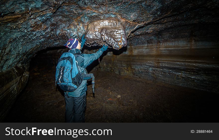 A man in an underground tunnel.