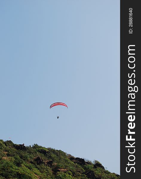 Paragliding in Goa over a small mountain top