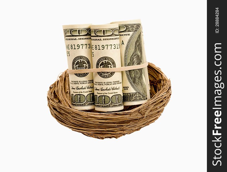 Rolls of hundred dollar bills in a nest.  Isolated on a white background. Rolls of hundred dollar bills in a nest.  Isolated on a white background.