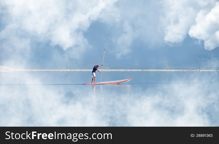 Guy surfing vacation at sea tourism